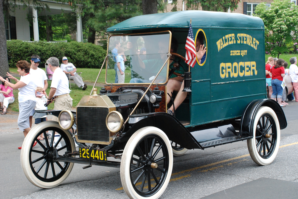 Alex Stewart driving the Model T in the 2007 Memorial Day Parade with Peter Lewis riding shotgun.